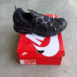 Nike Kukini All-Black Slip-On Athletic Sneaker with Cage Overlay